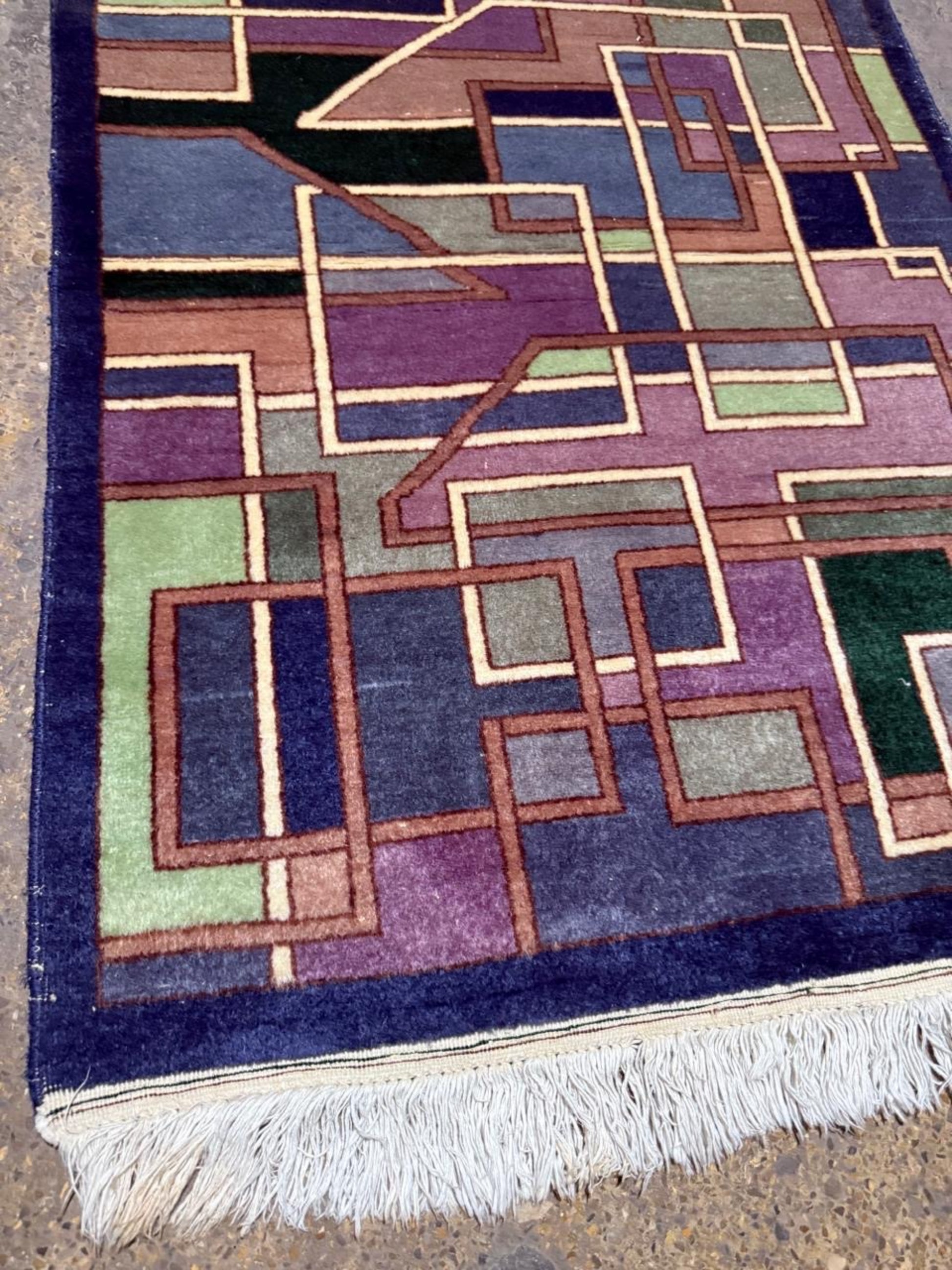 Contrast between deep indigo blue and vibrant purple blocks.

