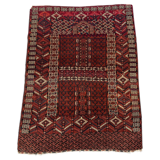 Full top view of the antique Turkmen Hachli rug showing the complete cross-form design.

