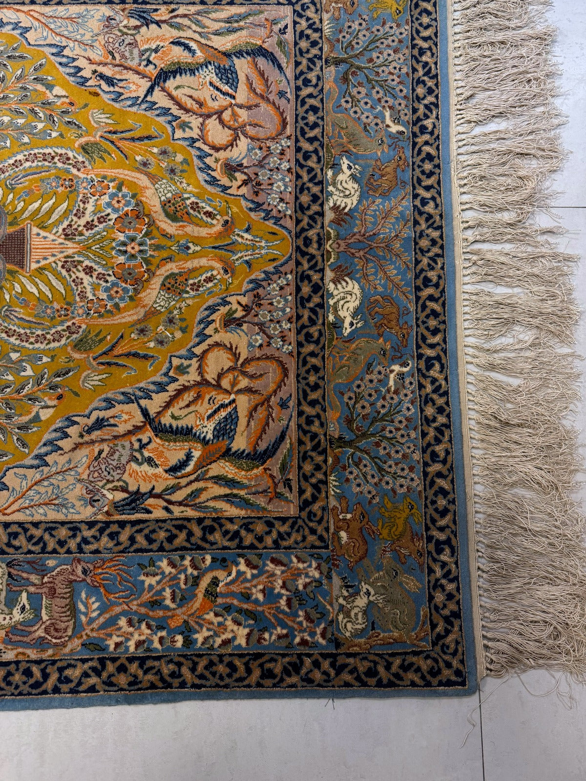 Detailed animal figures surrounding central tree


