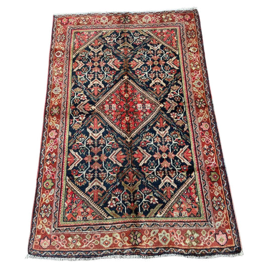 Full top view of the antique Persian Mahal rug showing the large geometric medallion.


