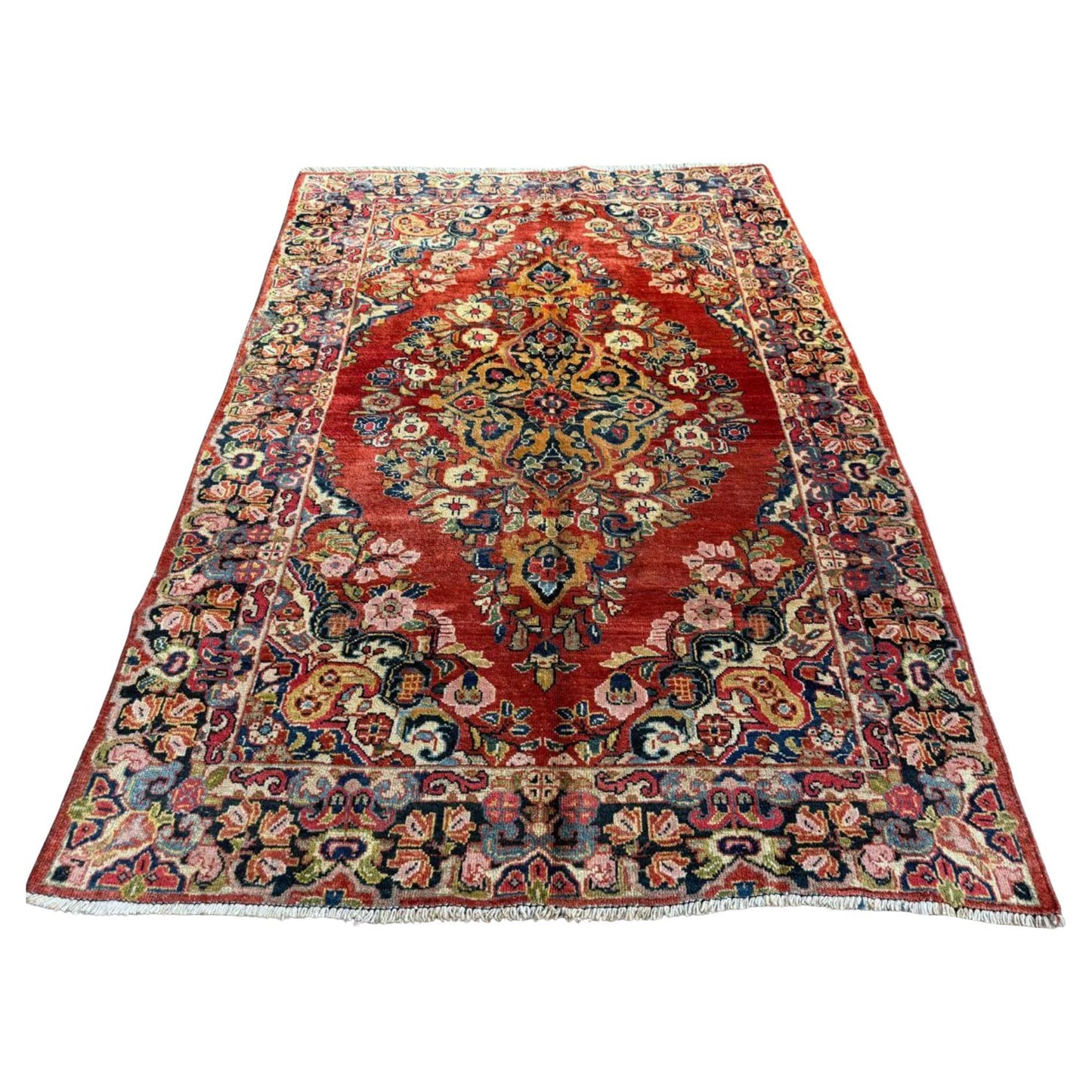 Full top view of the antique Persian Sarouk rug showing the large central medallion.

