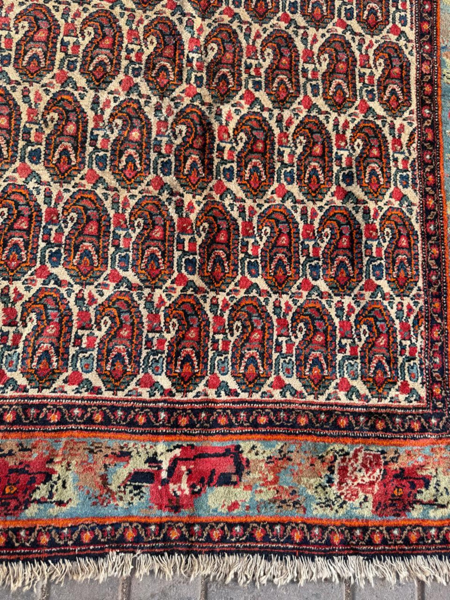 Deep indigo outlines surrounding delicate paisley shapes

