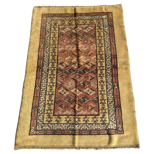 Antique camel hair rug with golden mustard border

