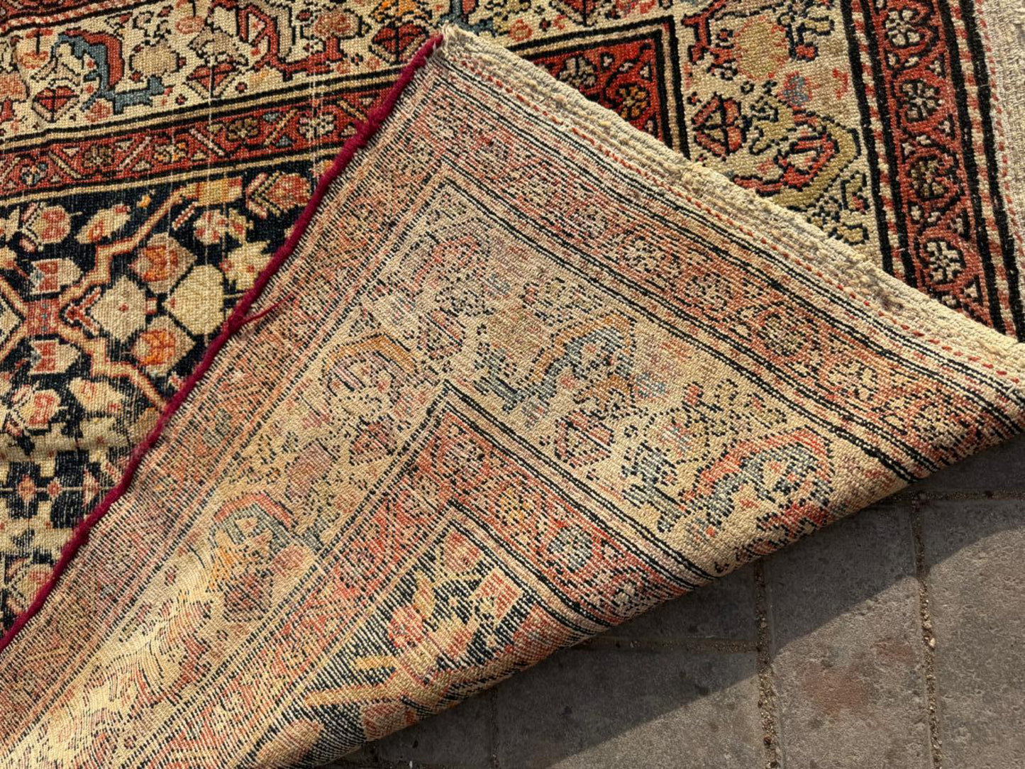 Dark indigo field with cream and terracotta patterns

