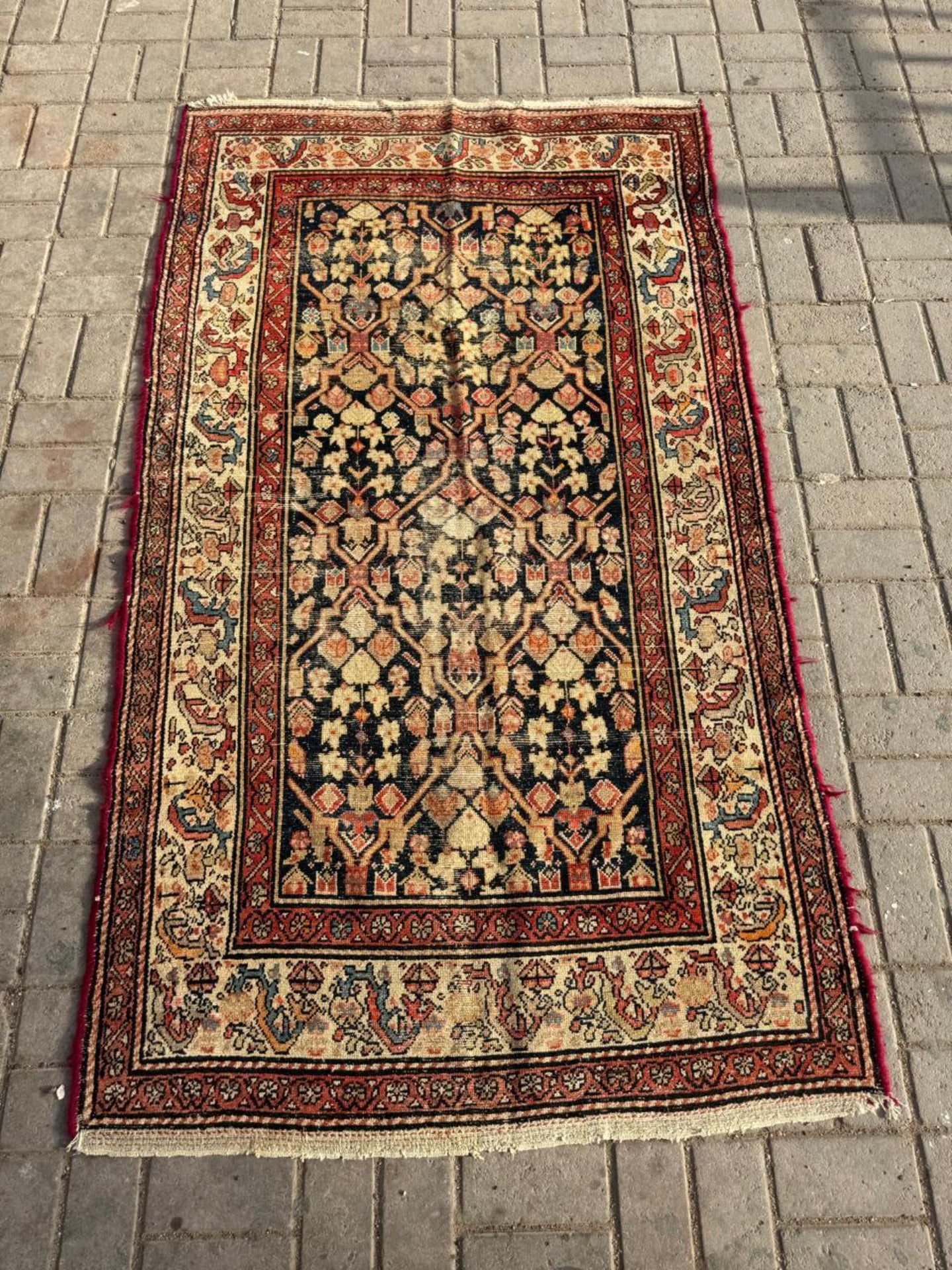 Wide brick red border with intricate detailing

