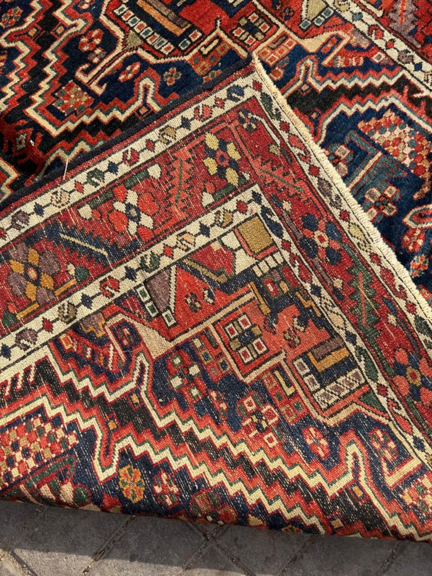 Brick red and gold accents in compartment designs

