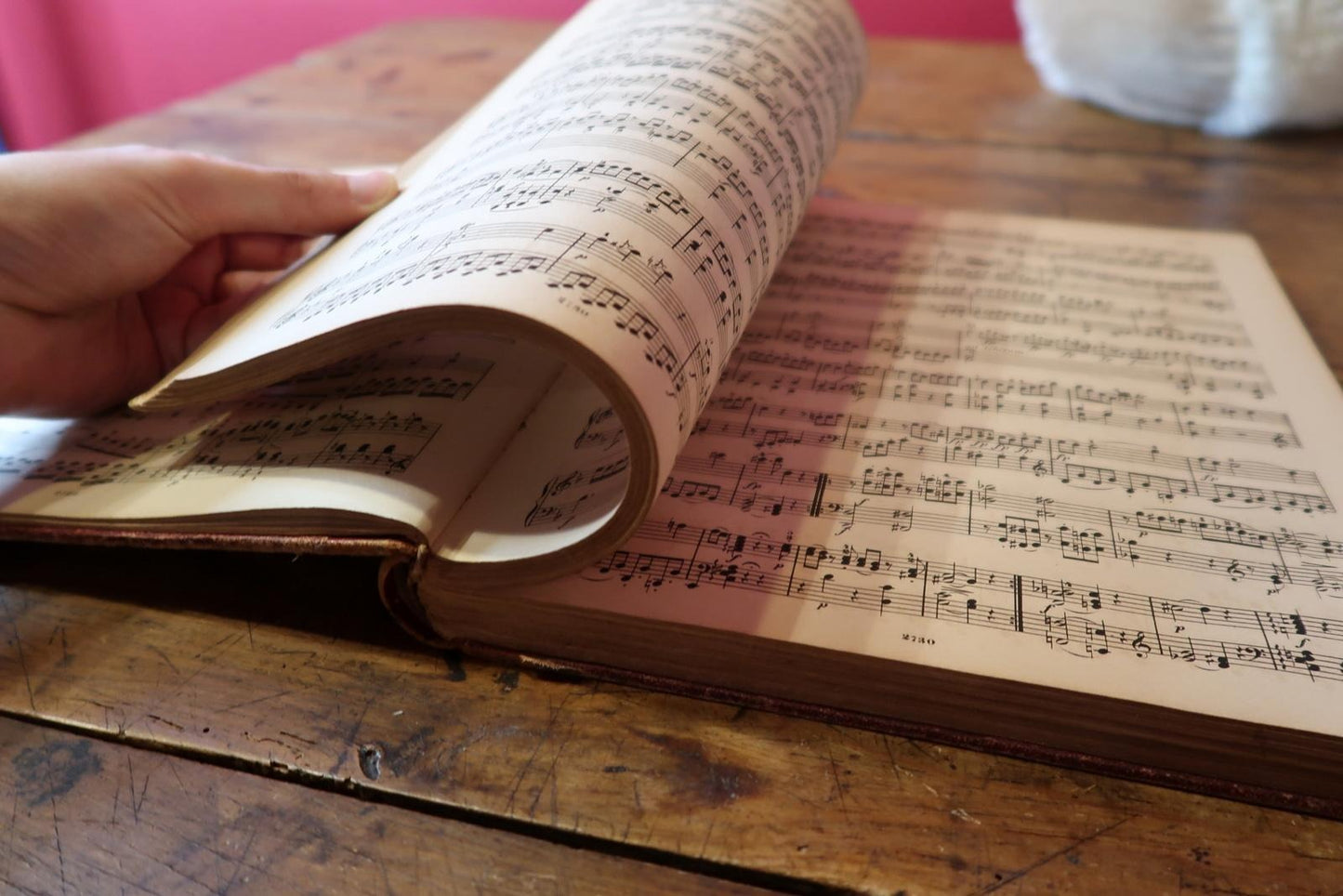 Open book showing two-page spread of musical scores

