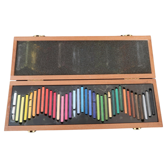 Open box showing full arrangement of unused chalk sticks

