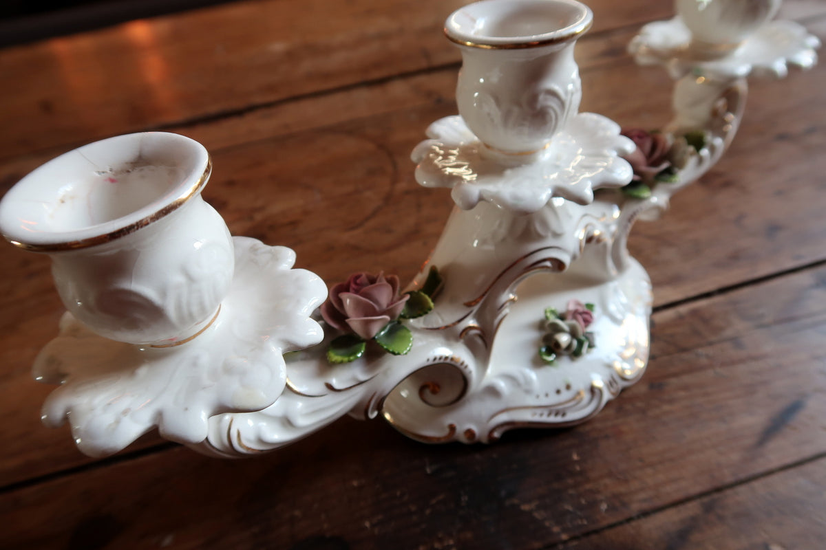 Hand-painted Bavarian porcelain tabletop centerpiece candle holder with three curved arms and gilded flourishes.