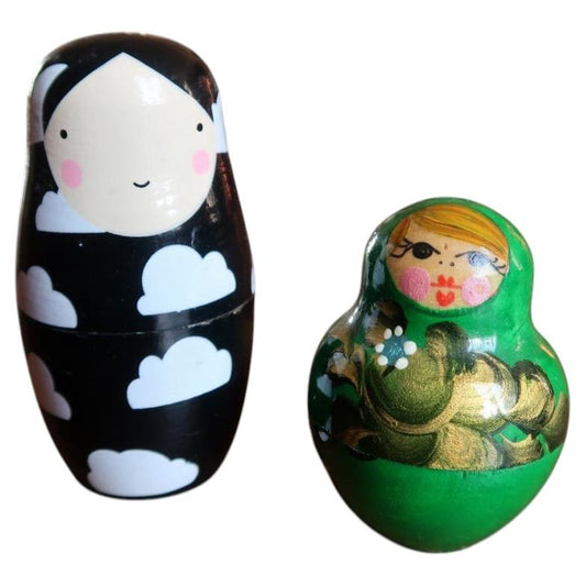 Vintage hand-painted Russian Matryoshka nesting dolls featuring traditional floral green design and modern sleek black composition (Ref: 2C113).