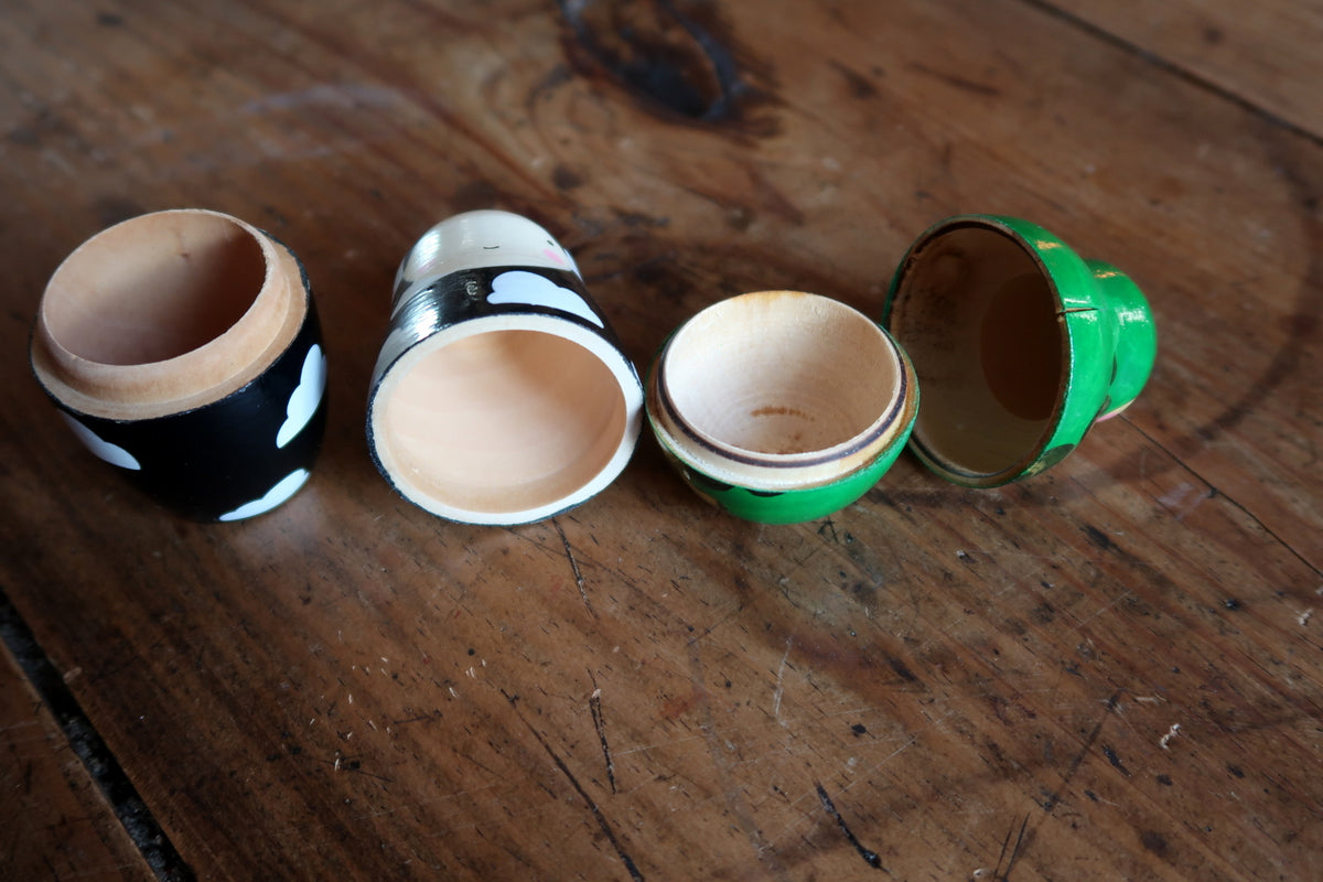 Stackable turned wood Matryoshka dolls featuring lathe-turned timber construction and precise nested fittings.