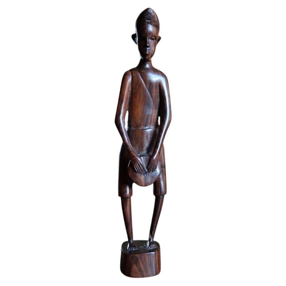 Mid-century hand-carved African hardwood male figure in polished dark ebony timber (Ref: 2C115).