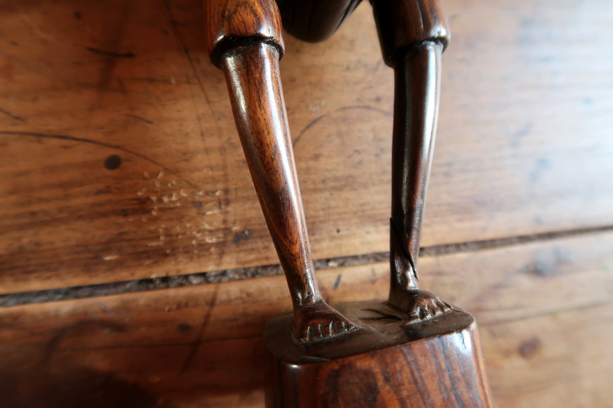 Proportional dimensions and balanced base construction on a vintage East African wooden art sculpture.