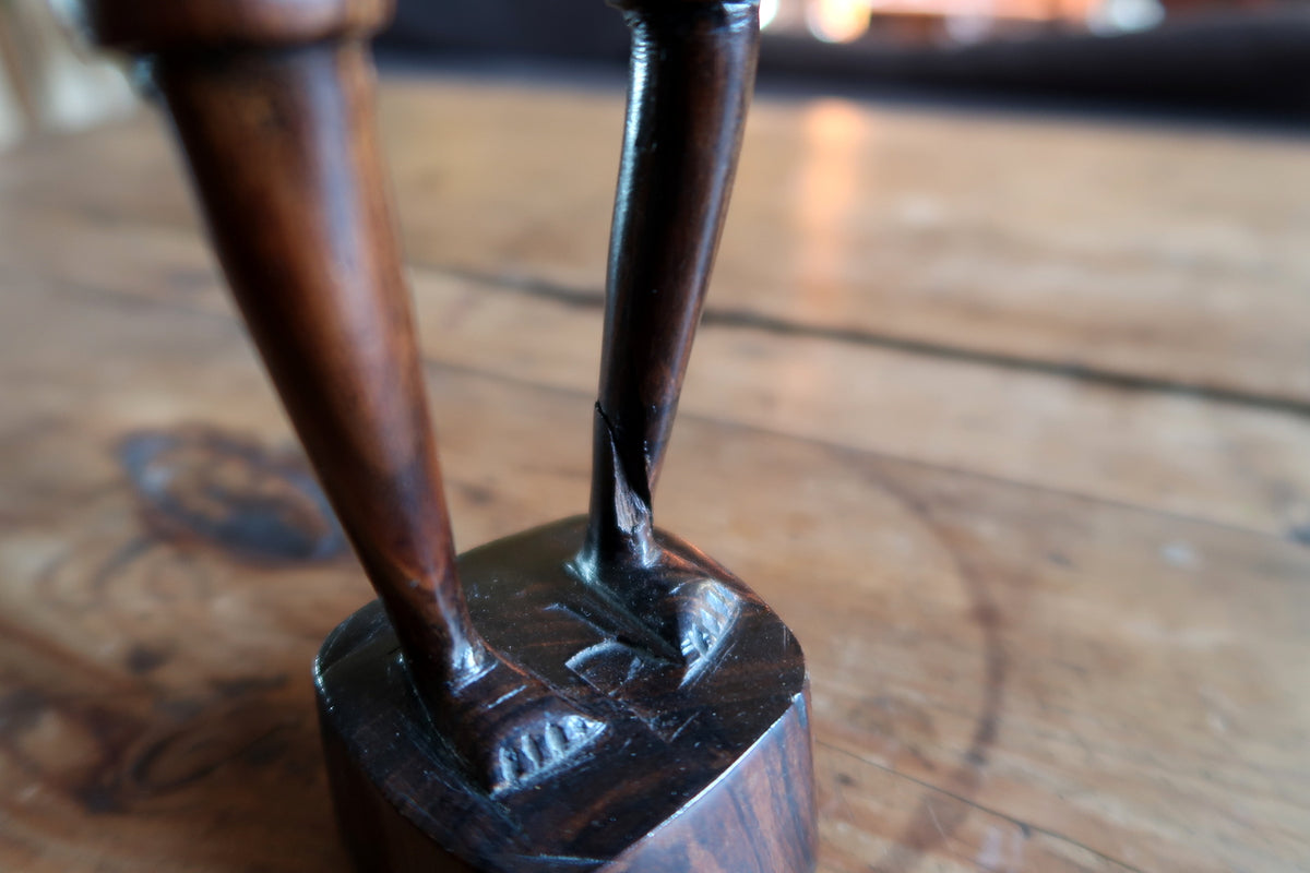 Back view displaying smooth polished dark hardwood surface and natural timber grain pattern.