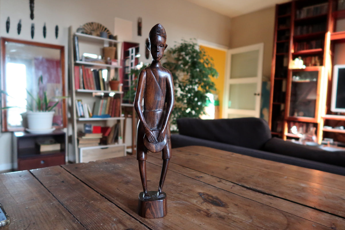 Smooth polished dark timber grain and rich natural patina on a vintage East African carved male figure.