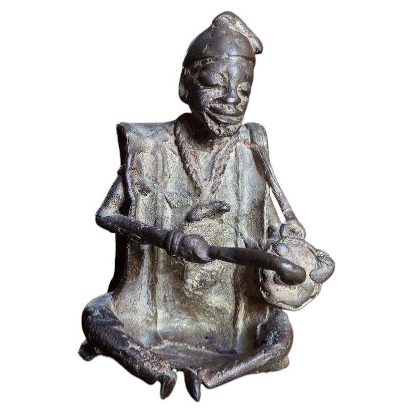 Mid-century West African lost-wax brass seated drummer figurine crafted in traditional Dogon tribal art style (Ref: 2C116).