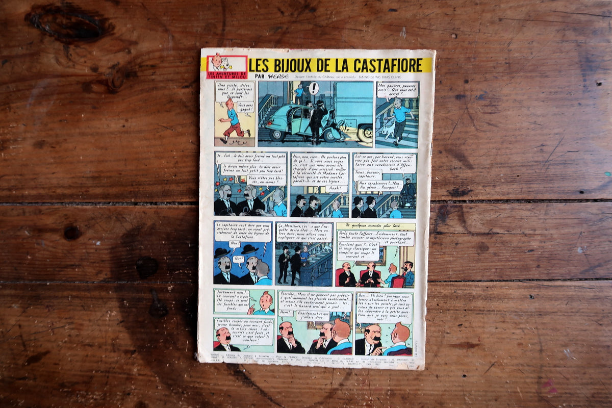 Full Les Bijoux de la Castafiore back cover showing blue-toned panels and edge wear
