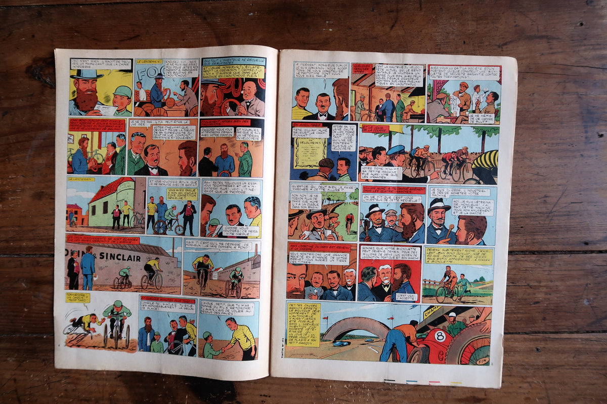 Colour comic spread showing cycling scenes and a red open-wheel racing car