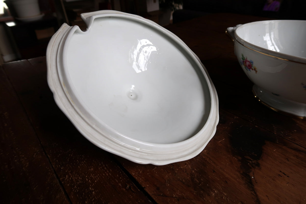 Underside of scalloped porcelain lid showing seating rim and ladle opening