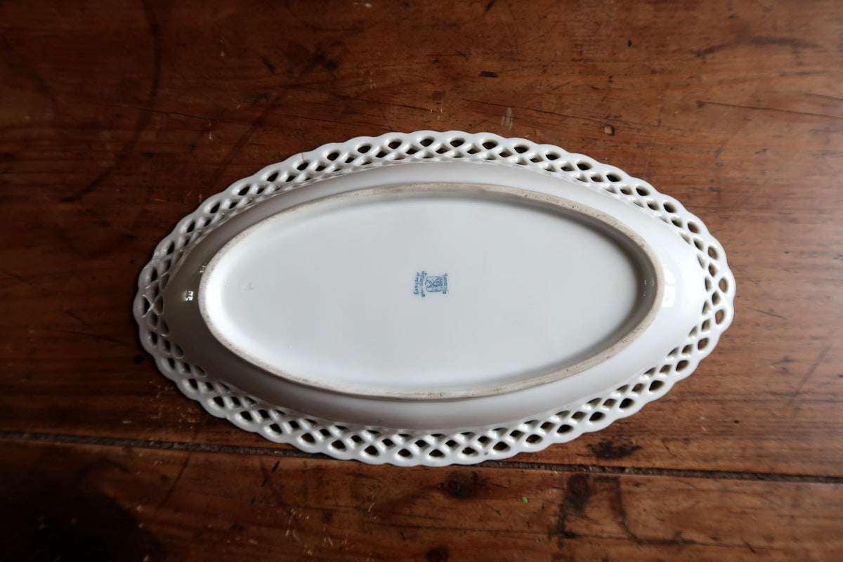White underside showing oval foot ring and blue maker's mark
