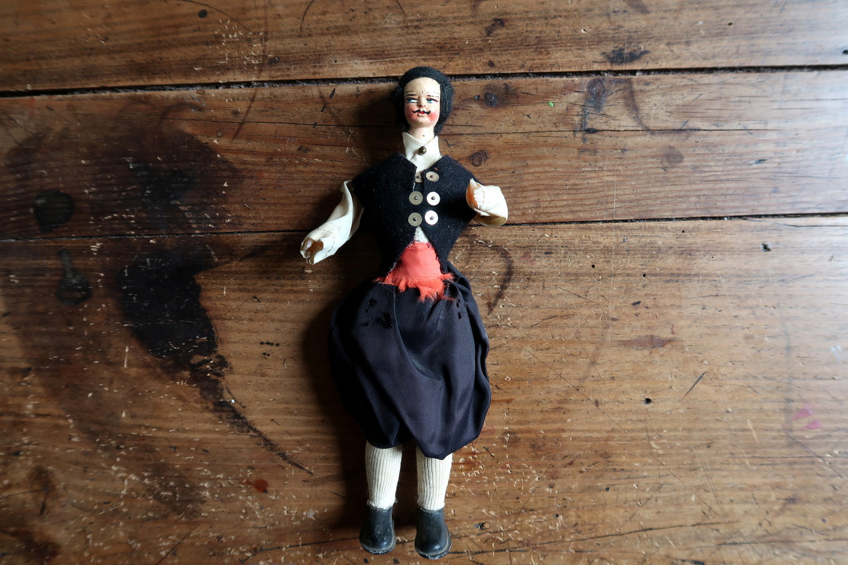 Full front view showing rounded breeches and cream stockings