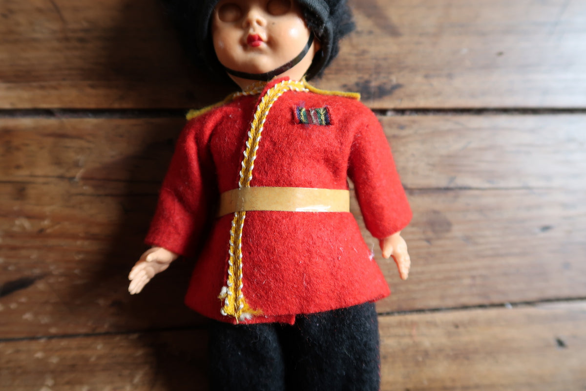 Scarlet tunic with shoulder tabs and miniature ribbon-style chest decoration