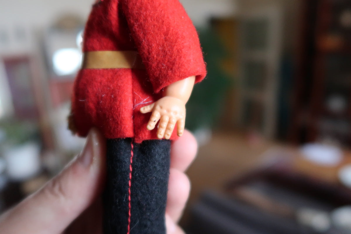 Side close-up showing hand marks and felt surface wear