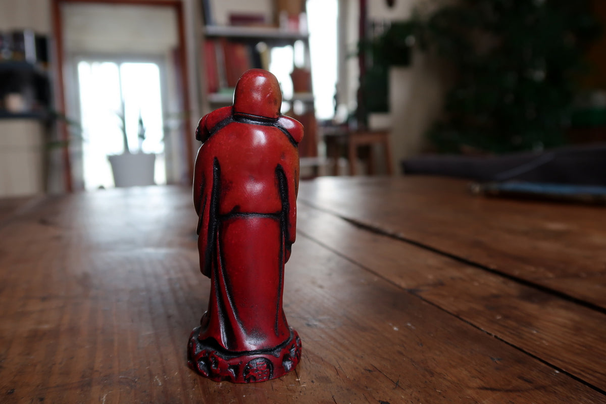 Rear view with red finish and black-outlined drapery