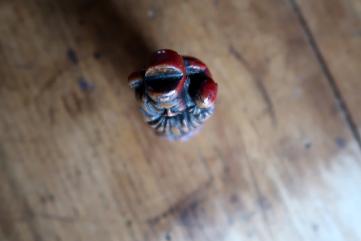 Overhead view of the elder's headwear and child