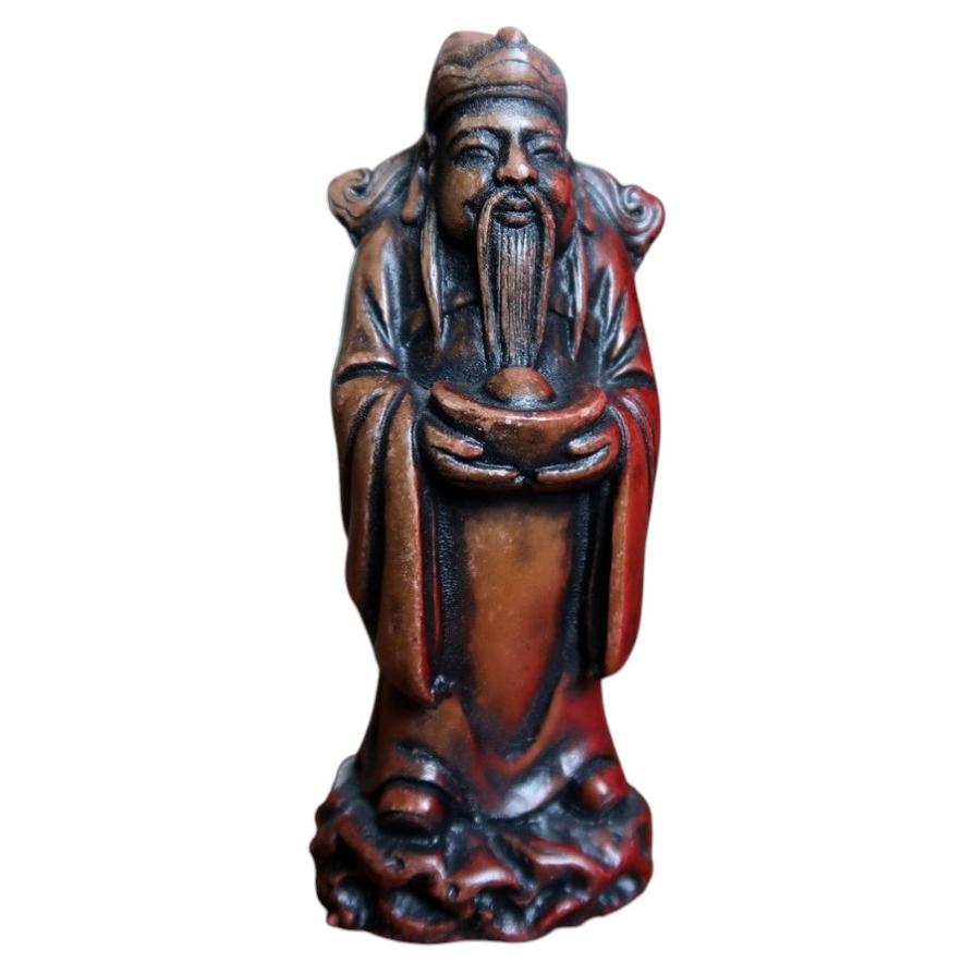 Vintage Chinese good-fortune resin figurine with long beard and red-brown robes