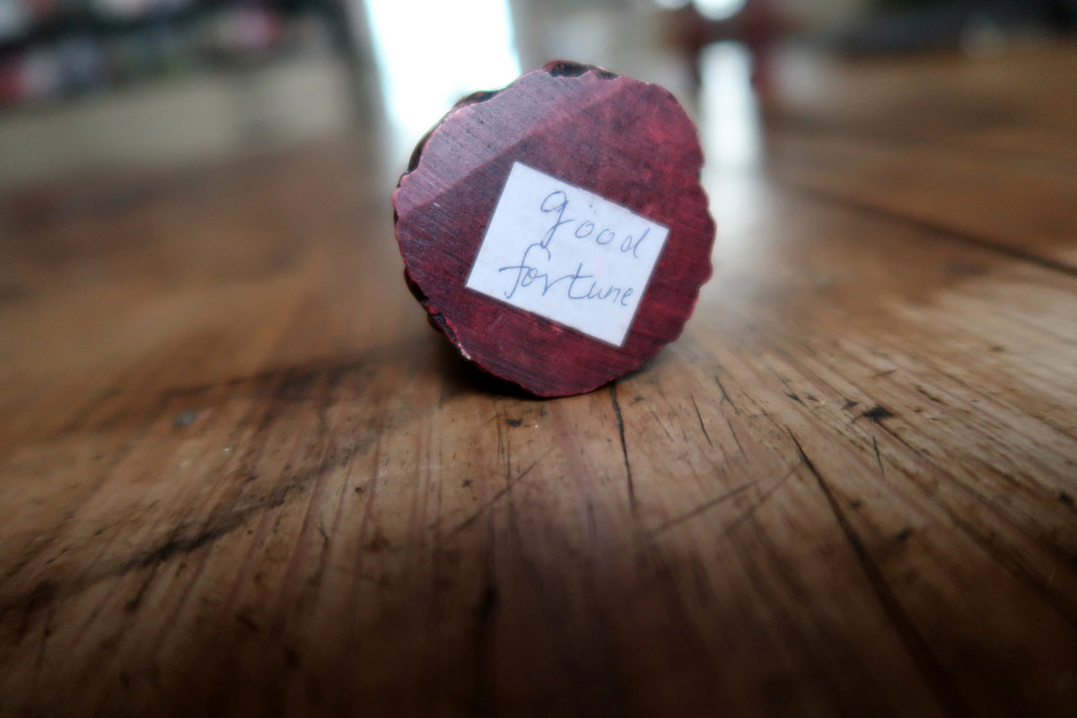 Front view showing hands holding a rounded object