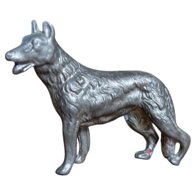 Vintage German Shepherd cast metal figurine with silver-grey textured coat