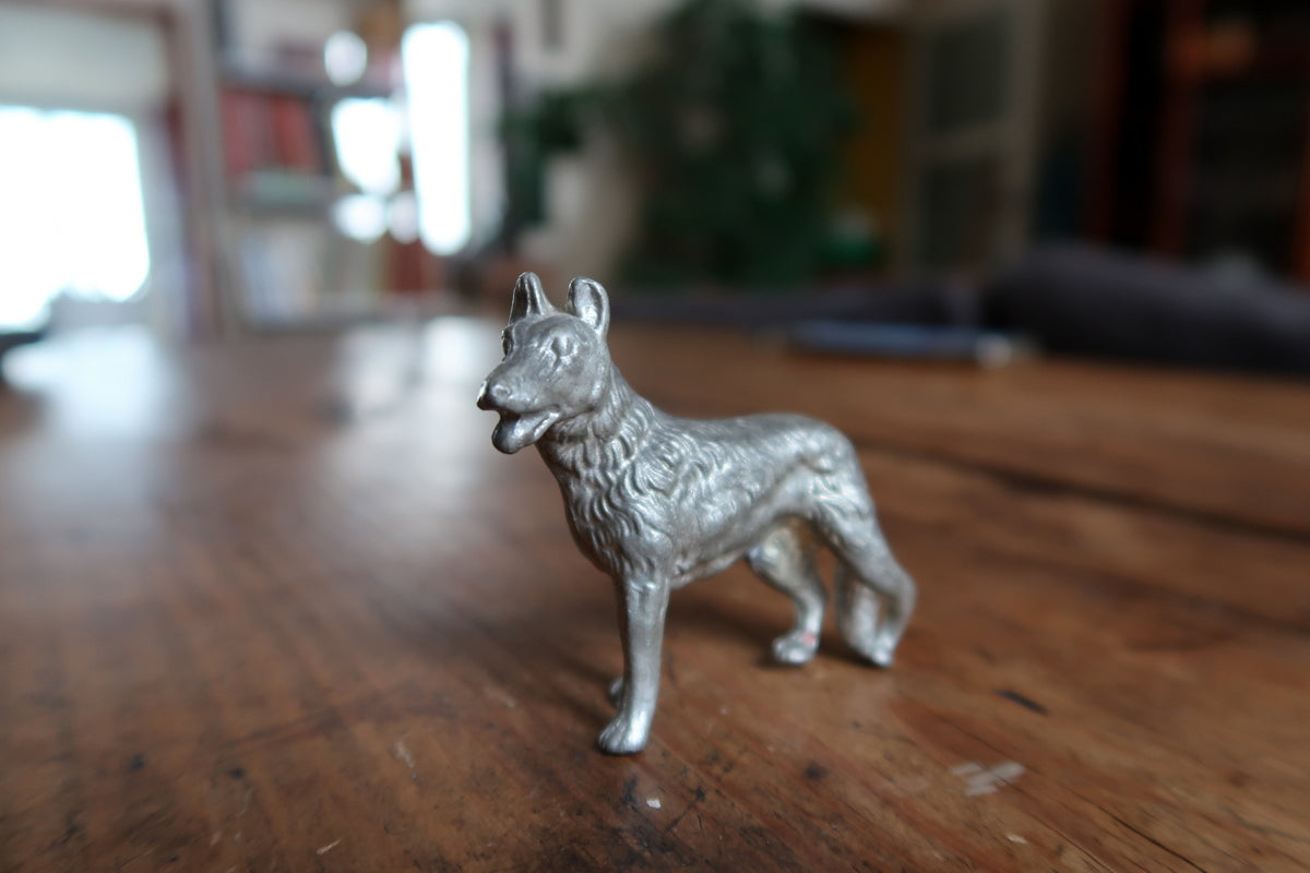 Angled view of the miniature dog’s modelled coat