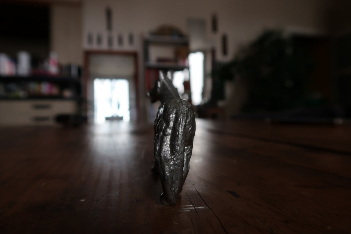 Small cast metal German Shepherd in a standing pose