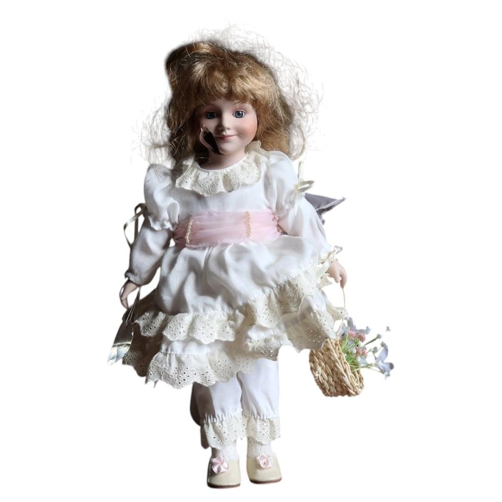 Damaged Elite Collection Porzellan doll in white embroidered dress with pink sash and flower basket.