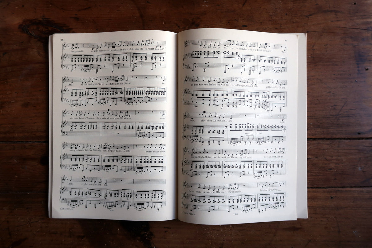 Front cover edge showing rubbing, small nicks and wear above the page block.