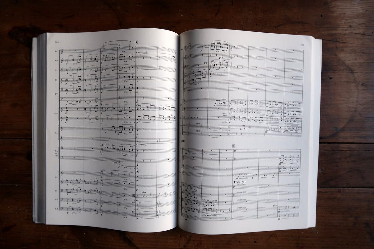 Front cover and page-block edge showing light curling and handling wear.