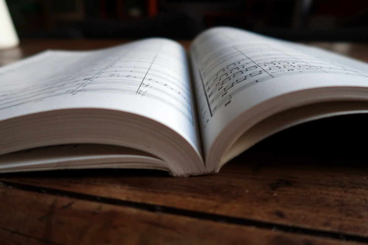 Interior spread of Debussy’s score with instrumental lines and performance markings.
