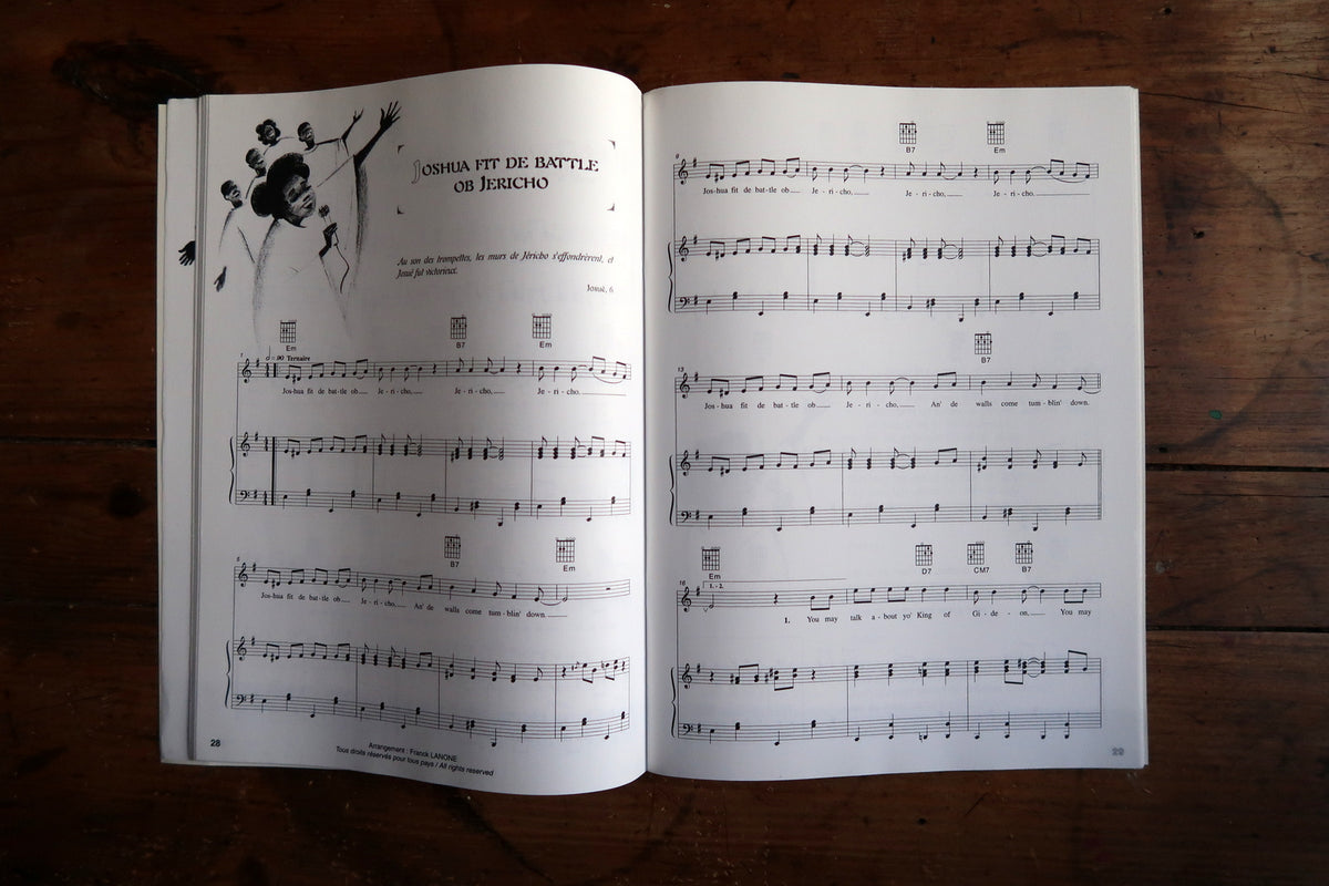 When the Saints Go Marchin’ In score with singer illustration and guitar chord diagrams.