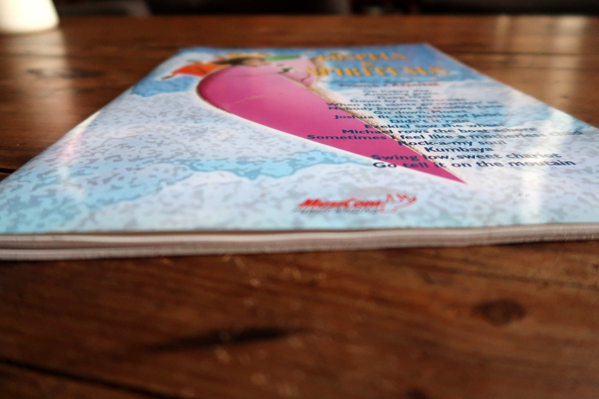 Front cover and page-edge detail showing light curling and handling wear.