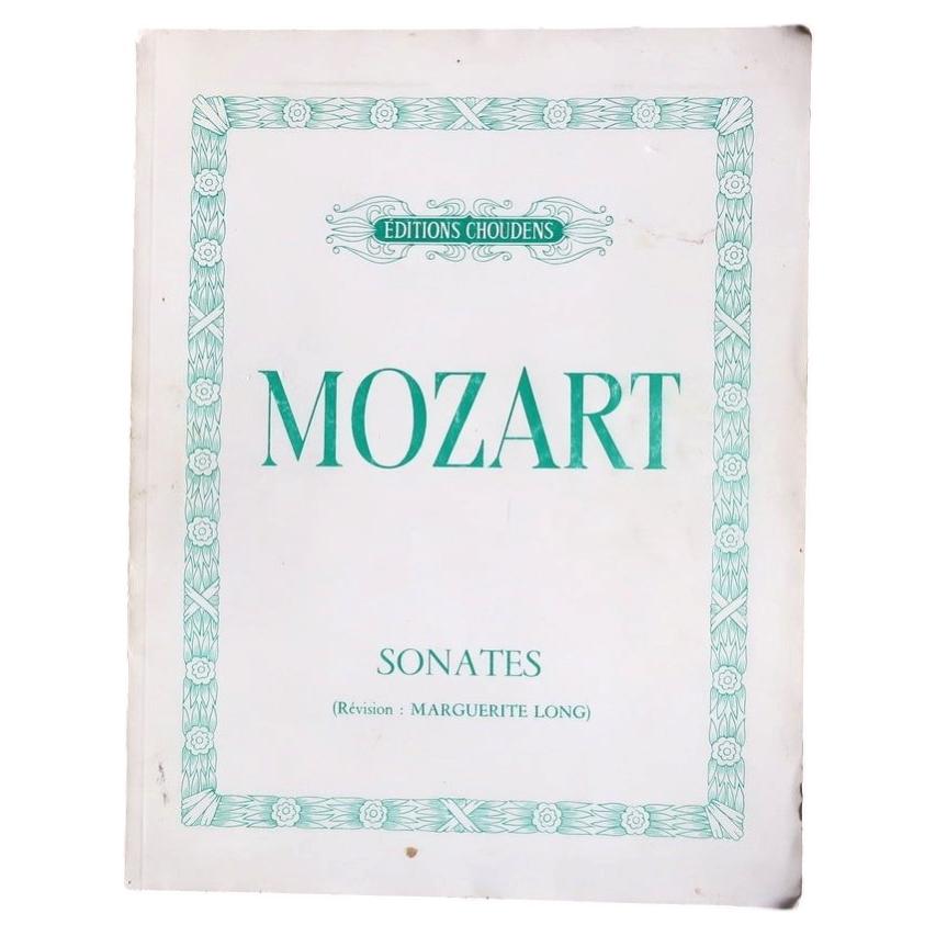 Open Choudens Mozart score showing piano notation and expressive markings across two pages.