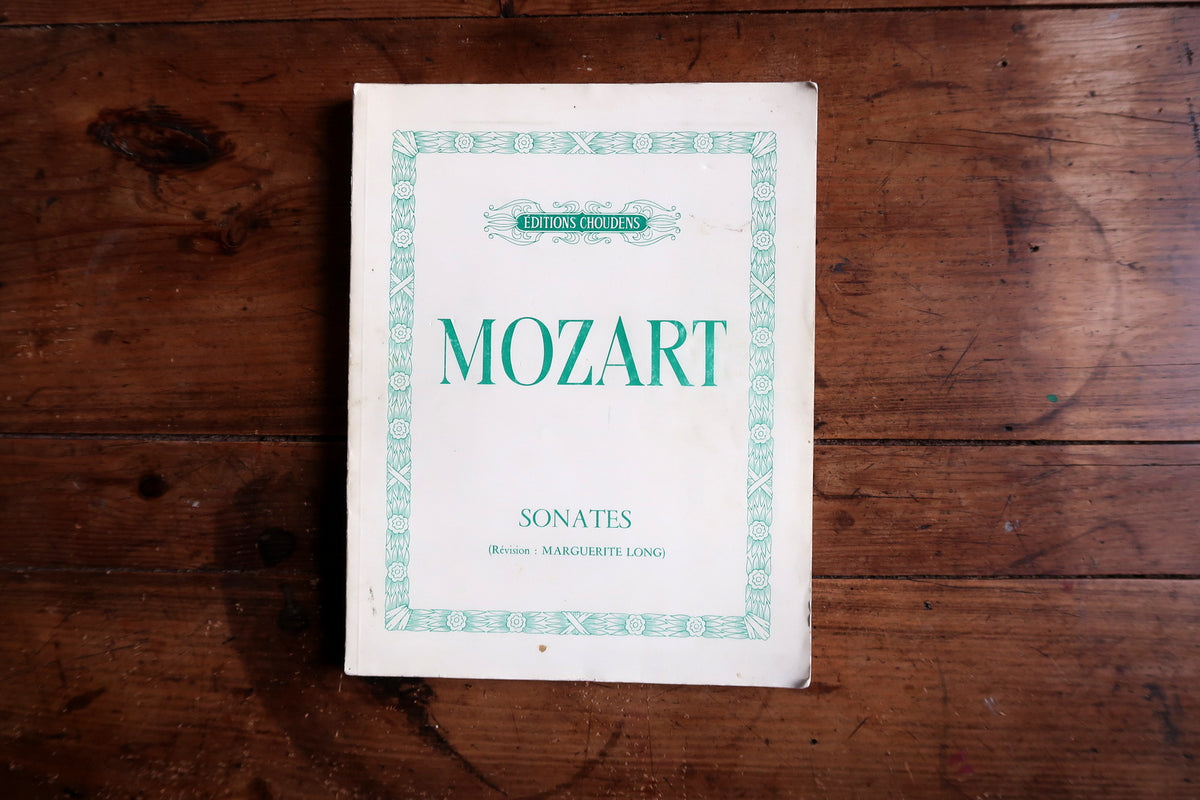 Mozart Sonata No. 10 opening with printed fingering and piano notation.