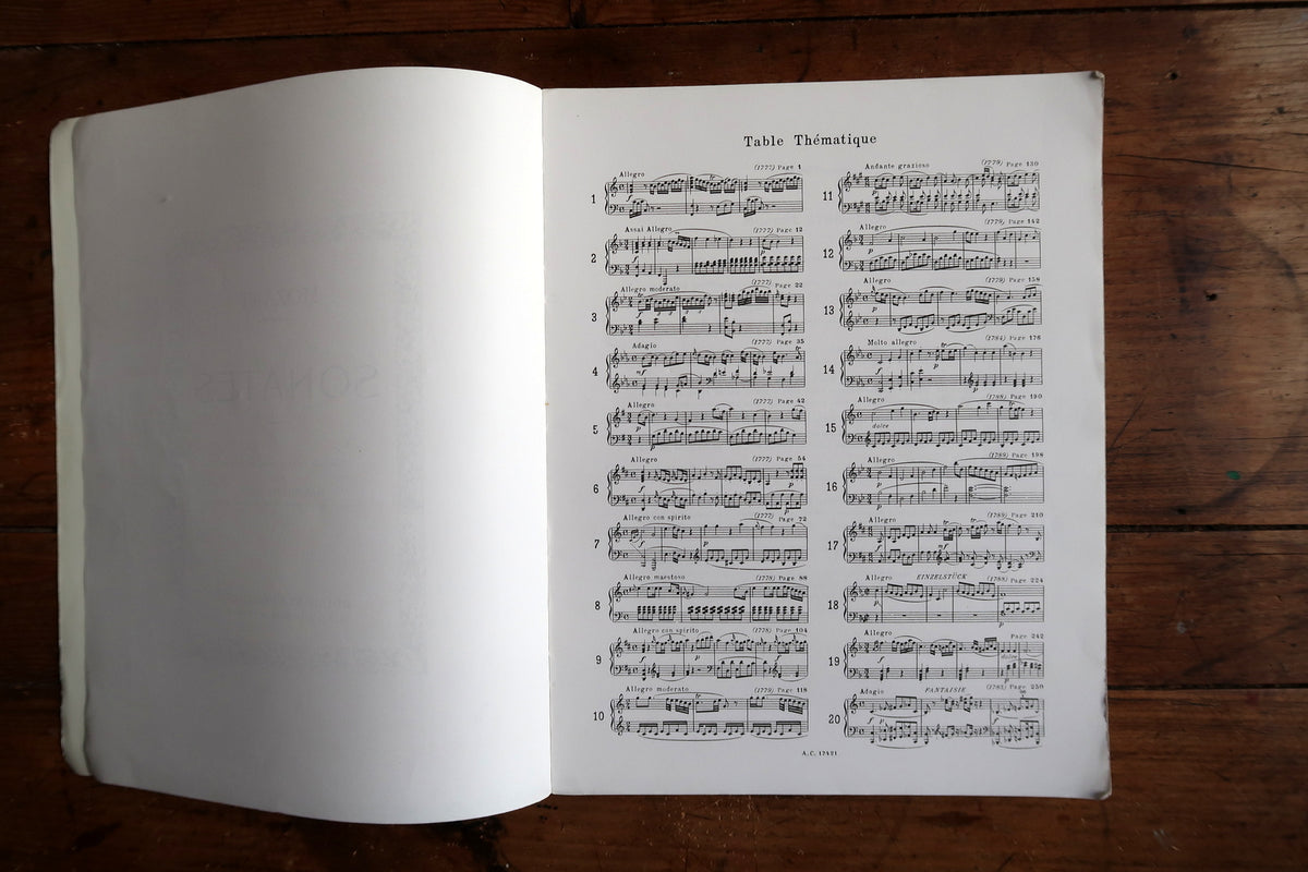 Open Mozart volume showing the curved pages and substantial bound page block.