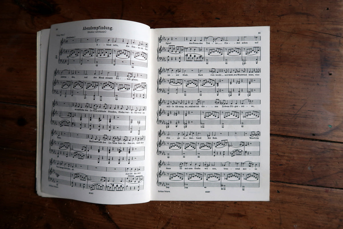 Low-angle Mozart Lieder cover showing the pale green border and slim page block.