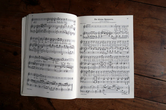 Abendempfindung score spread with German lyrics above piano accompaniment.