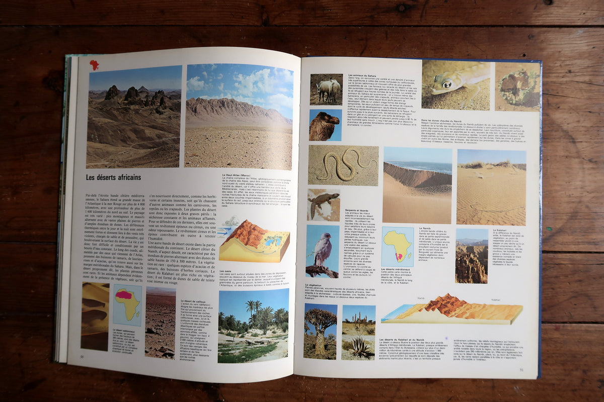 Atlas du monde vivant opening title spread with a full-page tropical landscape photograph.