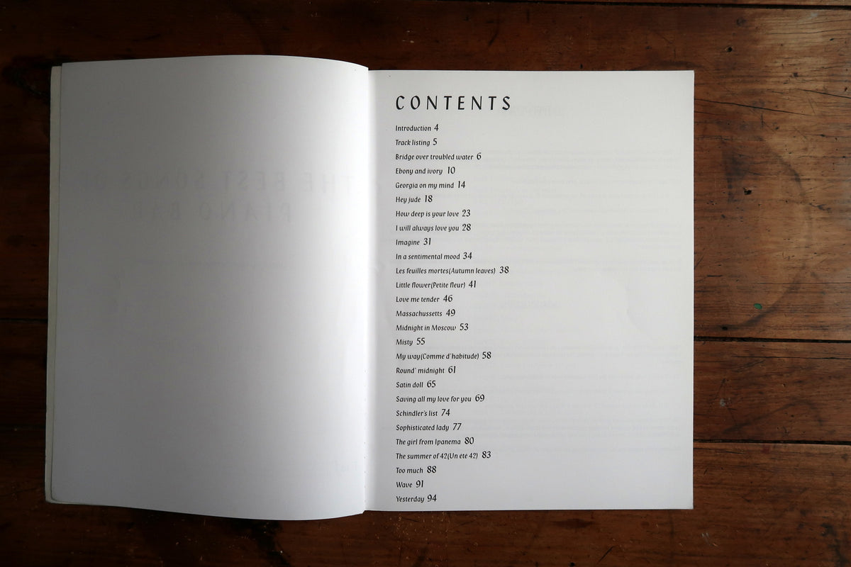 Contents page listing 25 piano arrangements from Bridge over Troubled Water to Yesterday.