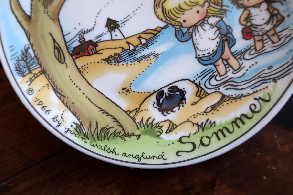 Sommer inscription and 1966 Joan Walsh Anglund copyright beside the blue crab and shoreline.