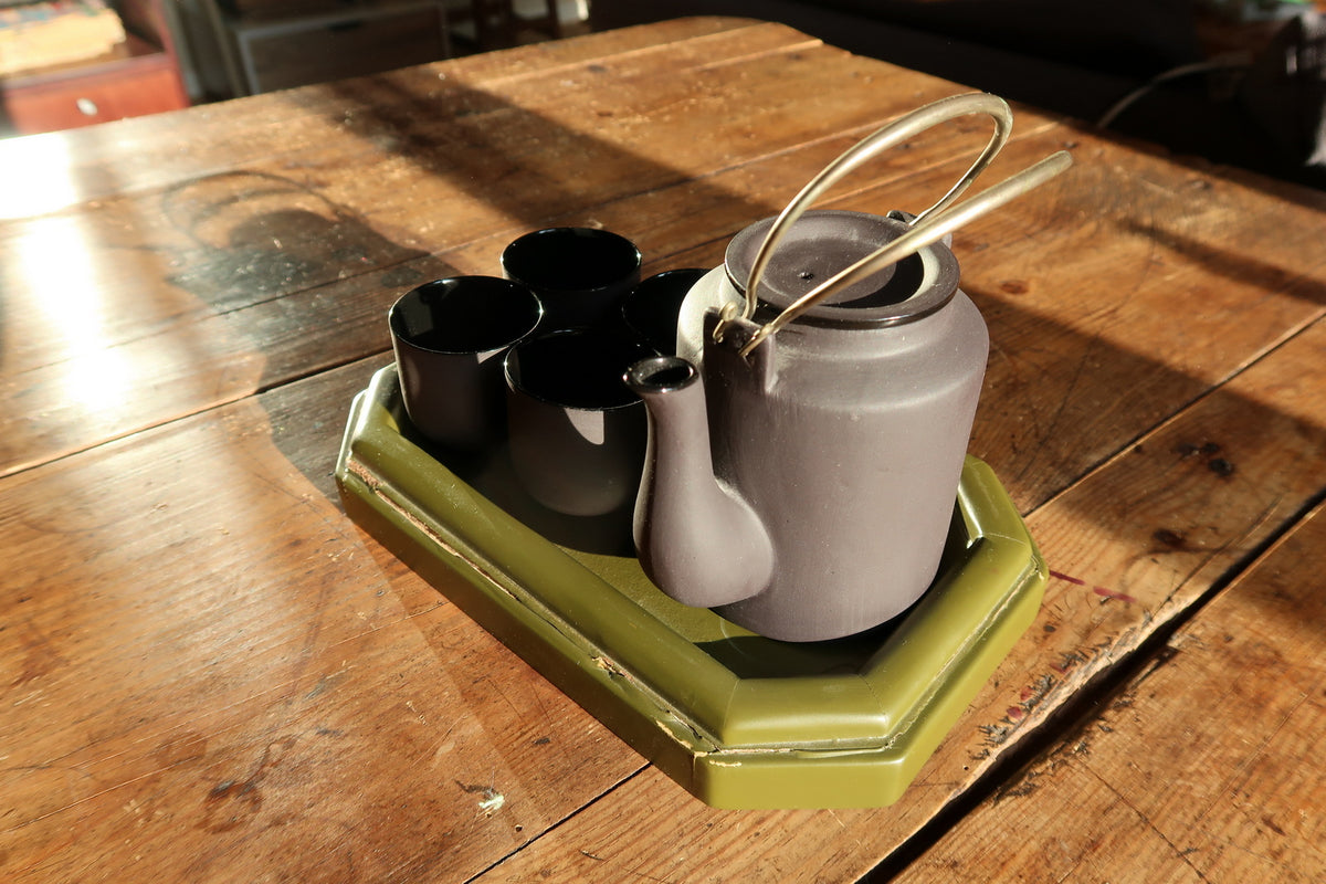 Vintage Vietnamese tea set close-up, glazed ceramic with smooth finish