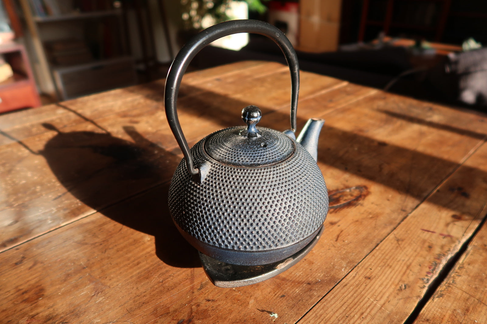 Vintage cast iron teapot, hobnail textured surface with classic Asian design